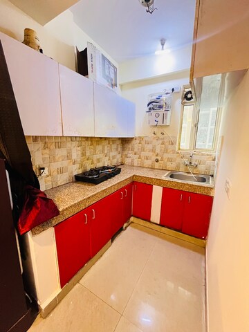 Kitchen in 3 BHK Apartment at Exotica Dreamville, Sector 16c Greater Noida – for Rent