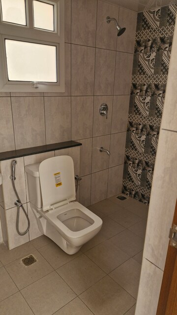 Bathroom in 2 BHK Apartment at Bhartiya Nikoo Homes Phase 2, Thanisandra Main Road – for Sale