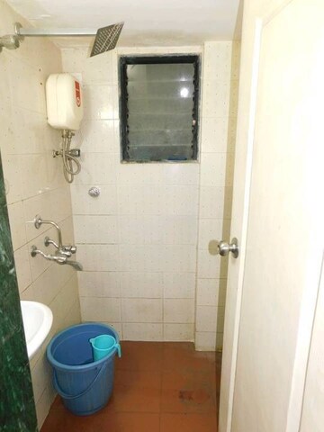 Bathroom in 1 BHK Apartment at Sanjay Gandhi Nagar CHS, Malad East – for Rent