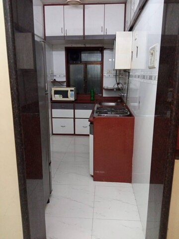Kitchen in 1 BHK Apartment at K Raheja Palm Court, Malad West – for Rent
