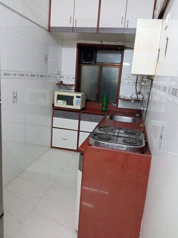 Kitchen in 1 BHK Apartment at K Raheja Palm Court, Malad West – for Rent