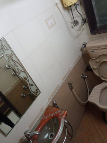 Bathroom in 1 BHK Apartment at K Raheja Palm Court, Malad West – for Rent