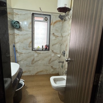 Bathroom in 3 BHK Apartment at Siddhi Highland Park, Kailash Nagar – for Rent
