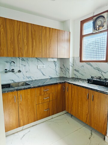 Kitchen in 2 BHK Builder Floor at Freedom Fighters Enclave – for Rent