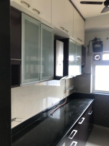 Kitchen in 2 BHK Apartment at Rustomjee Urbania Acura, Majiwada – for Sale