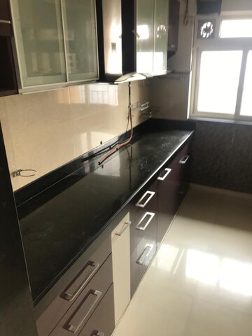 Kitchen in 2 BHK Apartment at Rustomjee Urbania Acura, Majiwada – for Sale