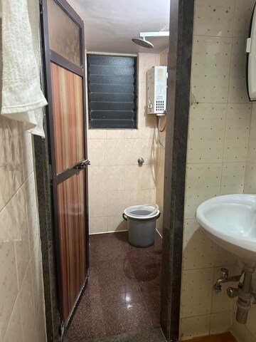 Bathroom in 1 BHK Apartment at River Park Complex, Dahisar East – for Rent