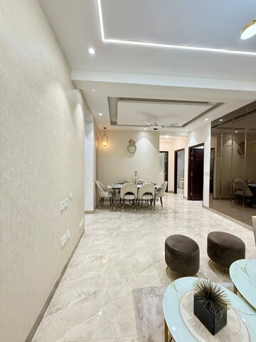 Living Room in 2 BHK Apartment at Artique Uptown Skylla, International Airport Road – for Rent