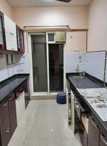 Kitchen in 2 BHK Apartment at Rosa Gardenia, Ghodbunder Road – for Sale