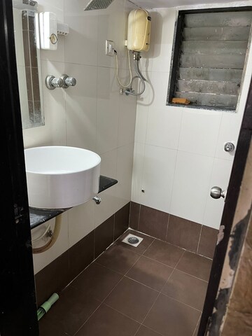 Bathroom in 1.5 BHK Apartment at Sadguru Complex, Mira Road – for Rent