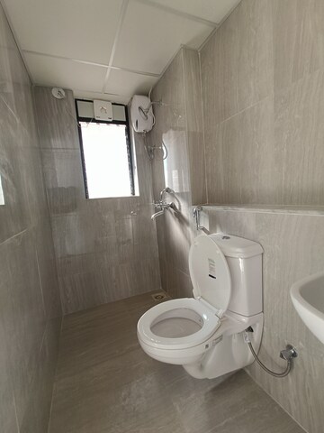 Bathroom in 1 BHK Apartment at Runwal Gardens, Dombivli East – for Rent