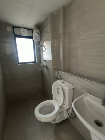Bathroom in 1 BHK Apartment at Runwal Gardens, Dombivli East – for Rent