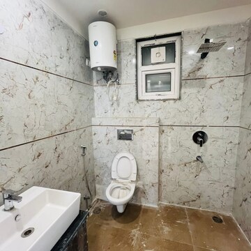 Bathroom in 4 BHK Builder Floor at Ansal API Esencia, Sector 67 – for Sale