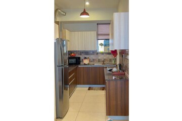 Kitchen in 3 BHK Apartment at Sushma Infinium, Ghazipur – for Sale