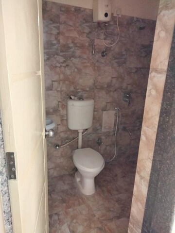 Bathroom in 2 BHK Apartment at Kuber Varshatai Tower, Kurla – for Rent