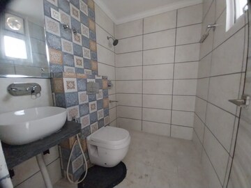 Bathroom in 3 BHK Apartment at Paradigm Business Hermitage Park, Dhakoli Village – for Rent
