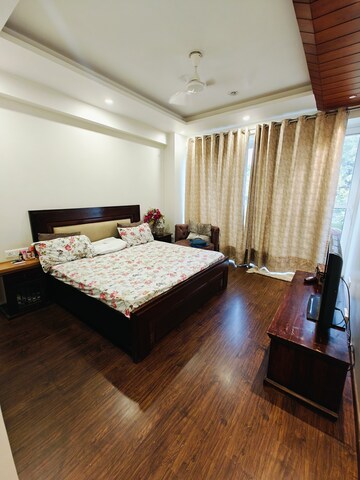 Bedroom in 3 BHK Builder Floor at Ansal Sushant Lok I, Sector 43 – for Rent