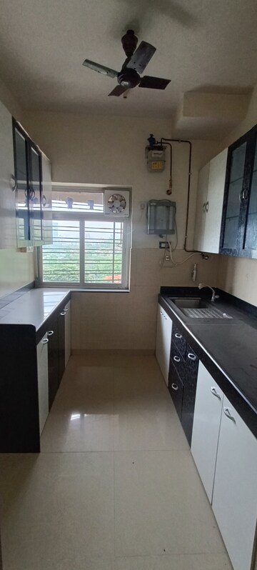 Kitchen in 2 BHK Apartment at Kalpataru Hills, Manpada – for Rent