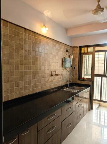 Kitchen in 2 BHK Apartment at Blue Mountain Towers, Shashtri Nagar – for Rent