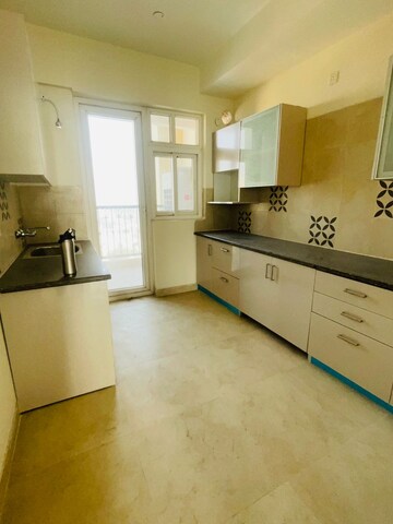 Kitchen in 3 BHK Apartment at ATS Triumph, Sector 104 – for Rent