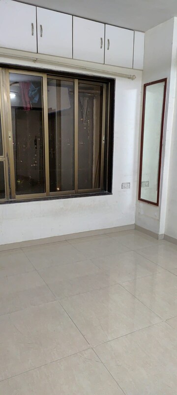 Room in 2 BHK Apartment at Gulmohar Upvan CHS, Gawand Baug – for Rent