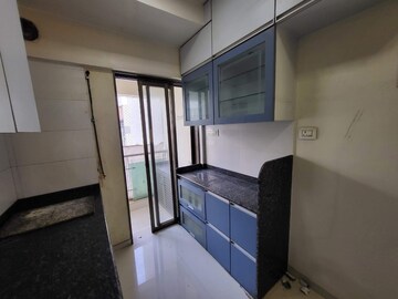 Kitchen in 2 BHK Apartment at Cosmopolis Tower, Andheri West – for Sale