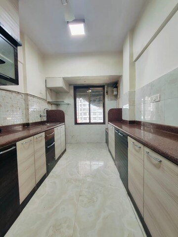 Kitchen in 2 BHK Apartment at Ani Anu Sri Balaji Enclave, Malad West – for Sale
