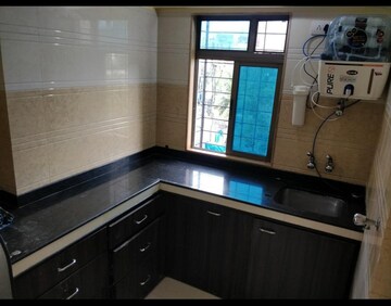 Kitchen in 2 BHK Apartment at Ani Anu Sri Balaji Enclave, Malad West – for Sale