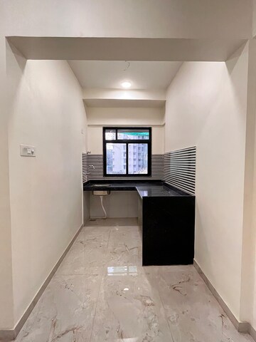 Kitchen in 2 BHK Apartment at Ani Anu Sri Balaji Enclave, Malad West – for Sale