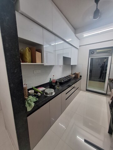 Kitchen in 2 BHK Apartment at Rustomjee Urbania Azziano L Wing, Majiwada – for Rent