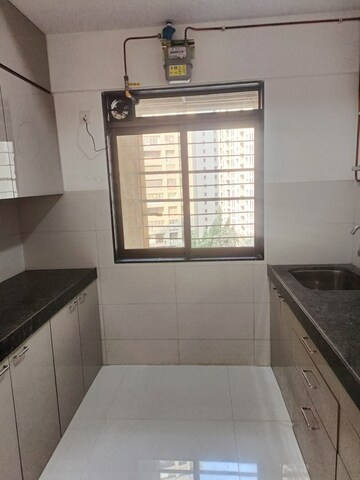 Kitchen in 2 BHK Apartment at Acme Ozone, Manpada – for Rent