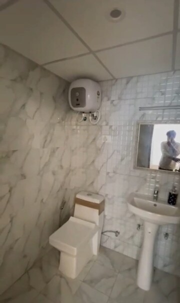 Bathroom in Studio Apartment at Alpha 1 Greater Noida – for Sale