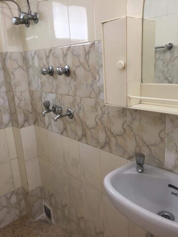 Bathroom in 1 RK Apartment at Defence Colony – for Rent
