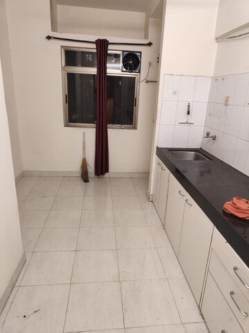 Kitchen in 1 BHK Apartment at Happy Valley, Manpada – for Rent
