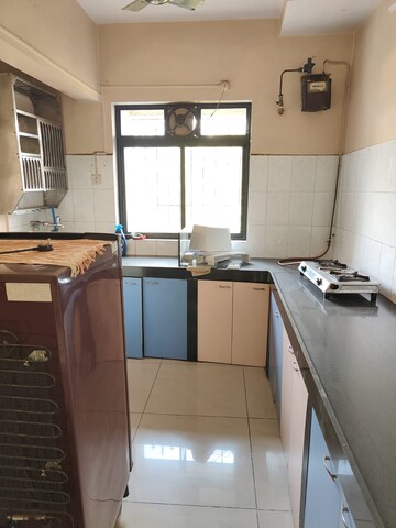 Kitchen in 1 BHK Apartment at Shubharambh Complex, Manpada – for Rent