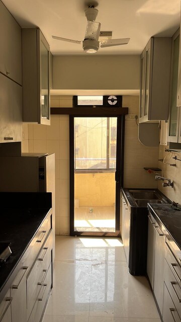 Kitchen in 3 BHK Apartment at Lokhandwala Infrastructure Harmony, Worli – for Rent