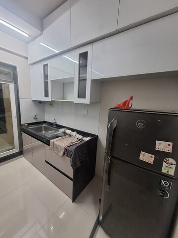 Kitchen in 2 BHK Apartment at Rustomjee Azziano Wing I, Majiwada – for Rent