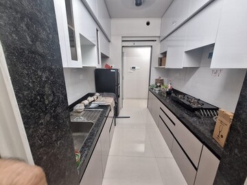 Kitchen in 2 BHK Apartment at Rustomjee Azziano Wing I, Majiwada – for Rent