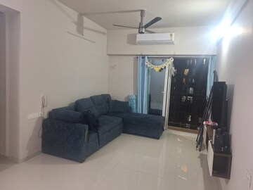 Living Room in 2 BHK Apartment at Rustomjee Azziano Wing I, Majiwada – for Rent