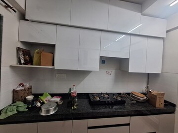 Kitchen in 2 BHK Apartment at Rustomjee Azziano Wing I, Majiwada – for Rent