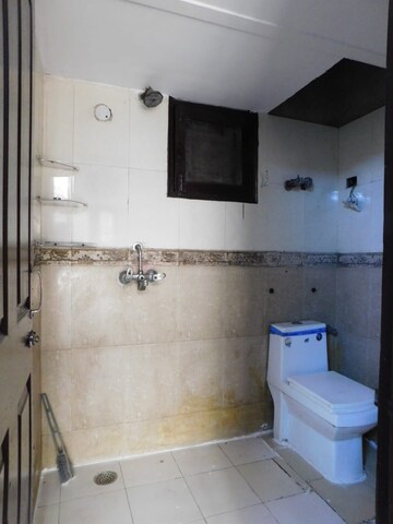Bathroom in 3 BHK Builder Floor at Chahak Plaza, Shakti Khand – for Rent
