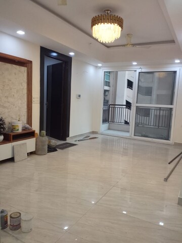 Living Room in 4 BHK Apartment at Saya Gold Avenue, Vaibhav Khand – for Rent