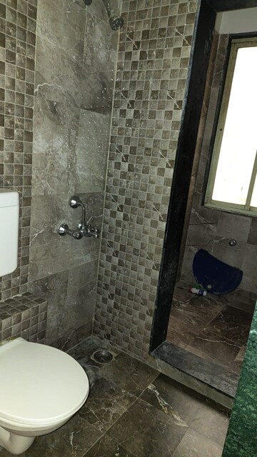 Bathroom in 1 BHK Apartment at Mohan Suburbia, Ambernath West – for Rent