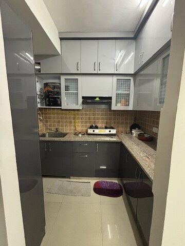 Kitchen in 2 BHK Apartment at Mahagun Mywoods III, Sector 16c Greater Noida – for Rent
