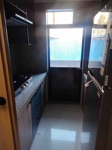Kitchen in 1 BHK Apartment at Virani Sky Heights, Kausa – for Sale