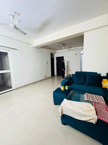 Living Room in 3.5 BHK Apartment at Aims Golf City, Sector 75 – for Rent