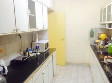 Kitchen in 2 BHK Apartment at Prestige Oakwood, Koramangala – for Rent