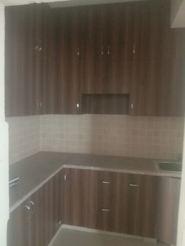 Kitchen in 2 BHK Apartment at Mahagun Mywoods, Sector 16c Greater Noida – for Rent