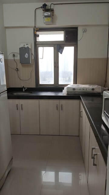 Kitchen in 1.5 BHK Apartment at Lodha Casa Royale, Balkum Pada – for Sale