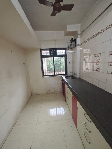 Kitchen in 2 BHK Apartment at Safal Residency, Nerul – for Sale